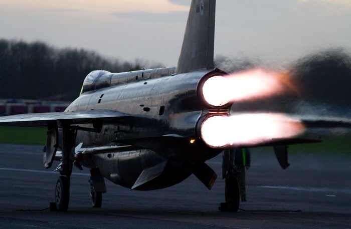Douglas F-6 Skyray fighter jet with engines firing