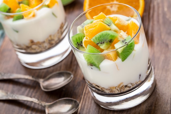 Fruit parfait with yogurt and granola in glasses