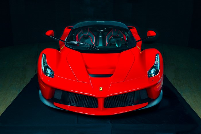 Red Ferrari LaFerrari on a black surface