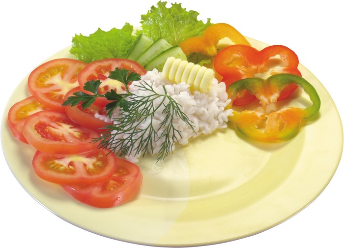 Plate of rice with tomatoes, cucumbers, lettuce, and bell peppers