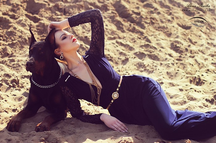 Alena Romanova with Doberman Pinscher on Sand