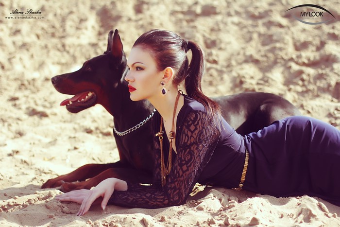 Alena Romanova with Doberman Pinscher on Sand