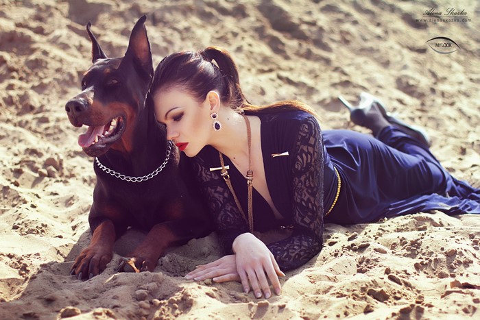 Alena Romanova with Doberman Pinscher on Sand