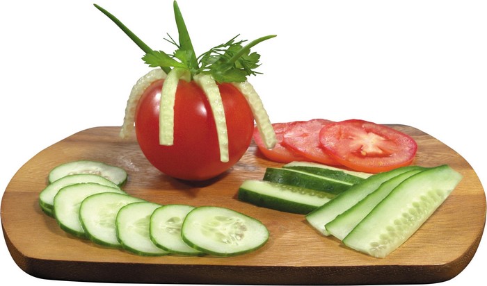 Tomato and cucumber garnish on a wooden board
