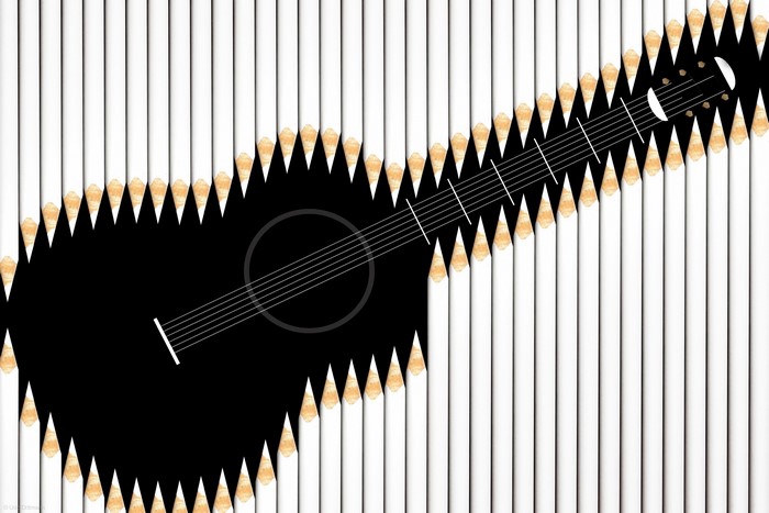 Guitar silhouette against white pencils