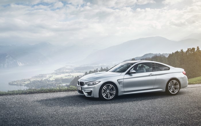 Silver BMW M4 Coupe on a Mountain Road