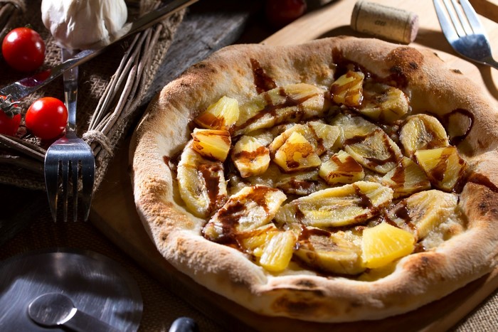 Banana and pineapple pizza with chocolate sauce