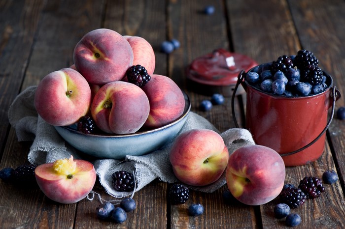 Peaches, Blackberries, and Blueberries on a Wooden Table