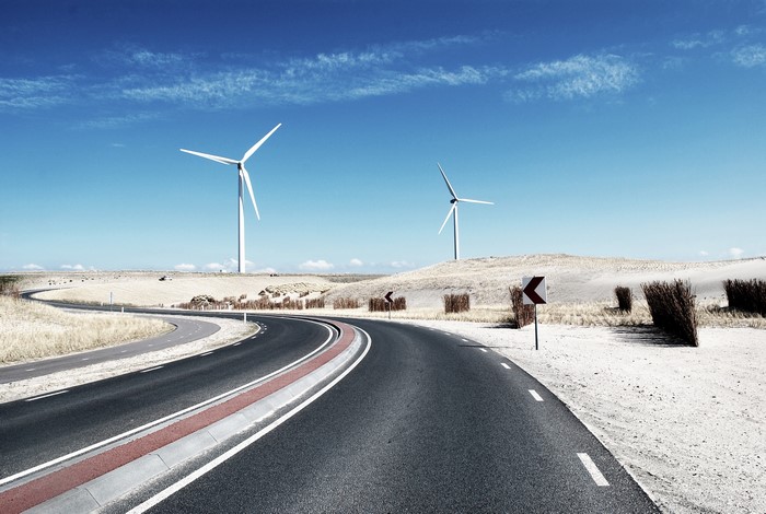 Roads and wind turbines under a blue sky