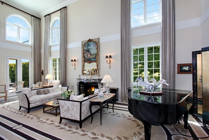 Living room with piano and fireplace