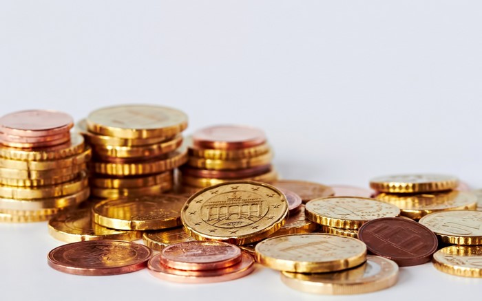 Stacks of Euro coins on a white background