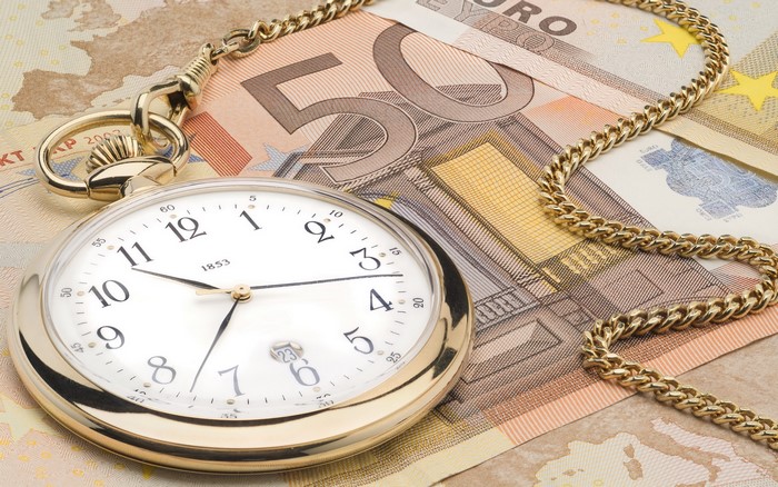 Pocket watch and Euro banknotes