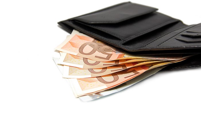 Black leather wallet with 50 Euro banknotes