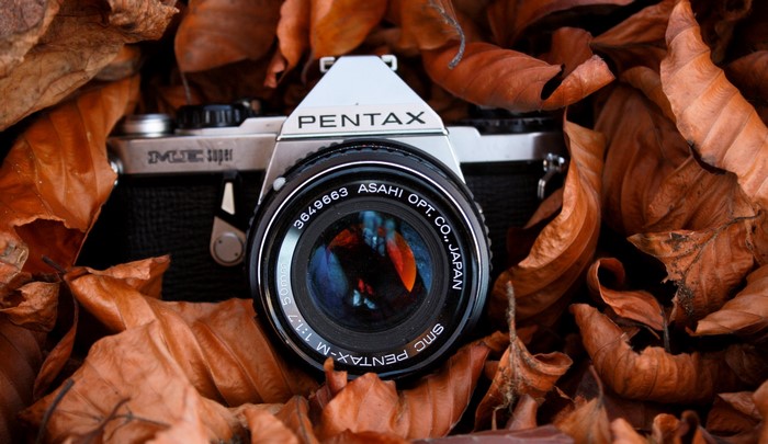 Pentax SMC Super camera among autumn leaves