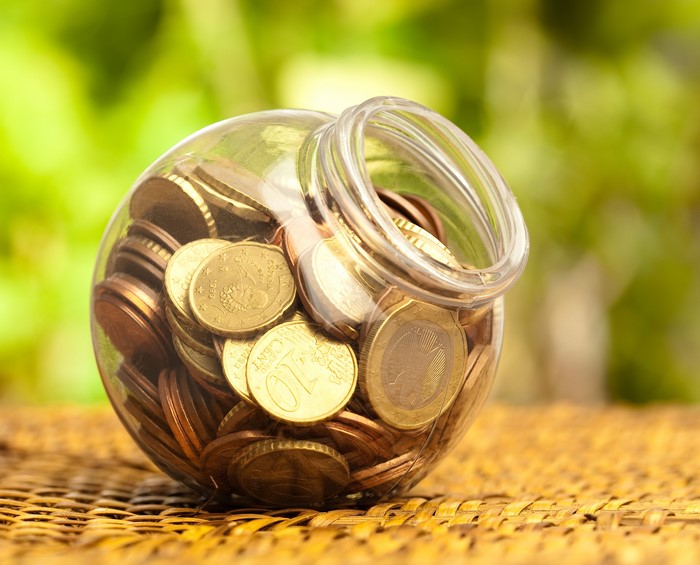 Glass jar filled with Euro coins