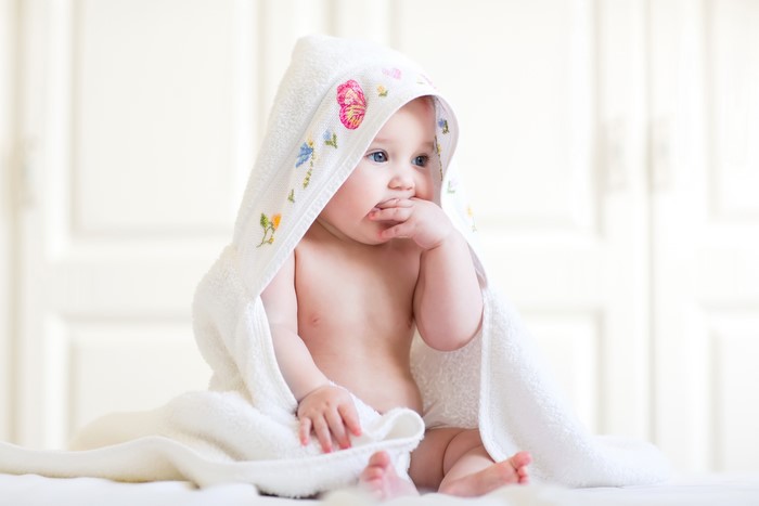 Baby in a hooded towel