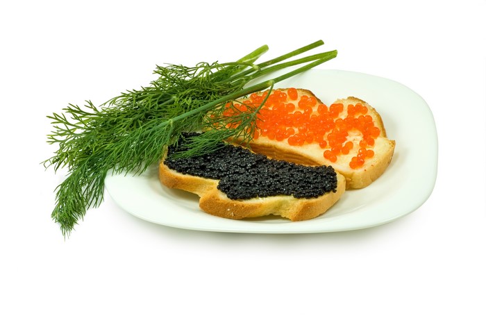 Bread with black and red caviar and dill