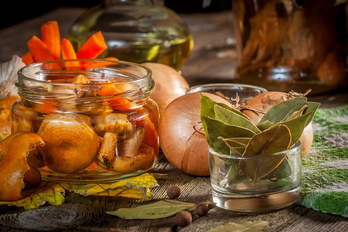 Pickled mushrooms and carrots in a jar