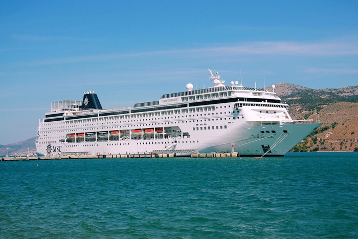 MSC Armonia cruise liner docked at a pier