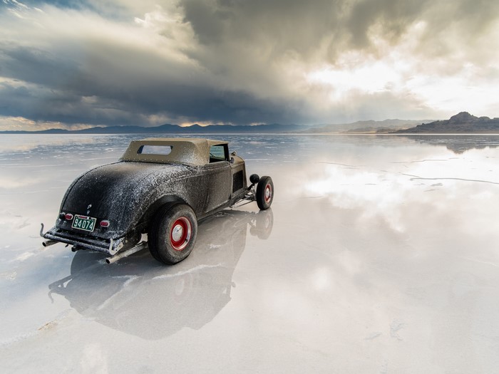 Retro convertible car on a salt flat
