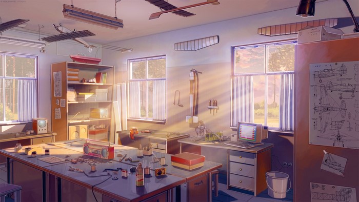 Model airplane workshop with sunlight streaming through windows