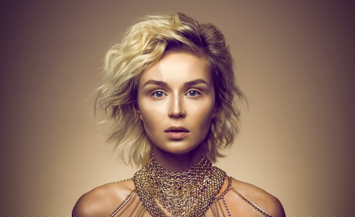 Blonde woman with gold necklace