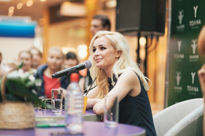 Polina Gagarina speaking into a microphone