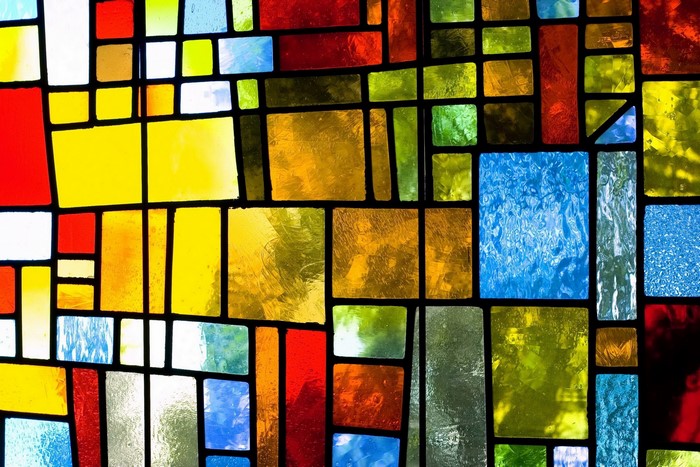 Abstract stained glass window with geometric patterns