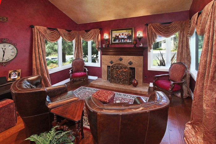 Living room with fireplace and armchairs
