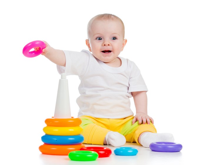 Baby playing with stacking rings toy