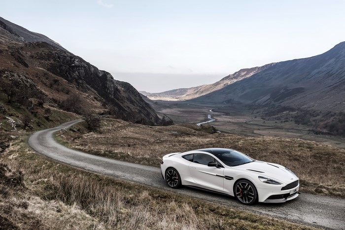 Aston Martin Vanquish Carbon White on a mountain road