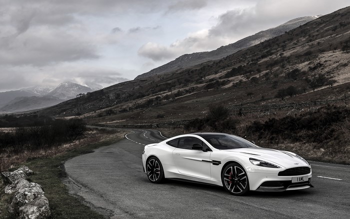 Aston Martin Vanquish Carbon White on a Winding Road
