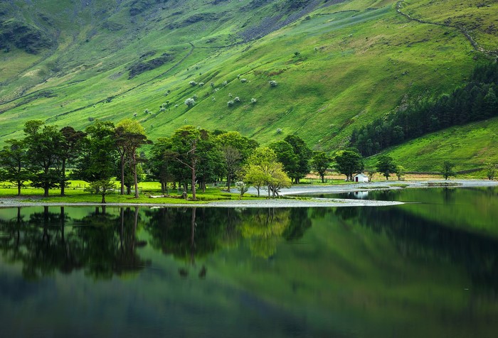 Lake with green hills and trees