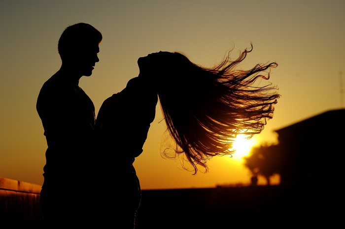 Couple in silhouette at sunset