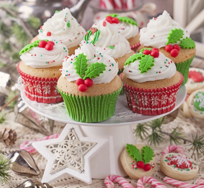 Christmas cupcakes with holly and berries