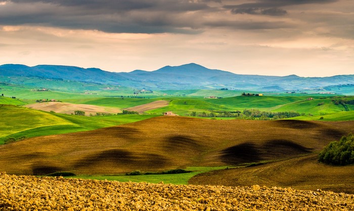 Tuscan Rolling Hills and Mountains Under Cloudy Sky