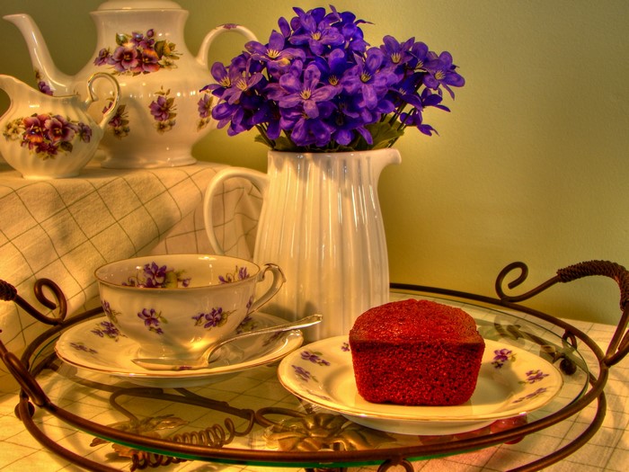 Tea set with flowers and red cake