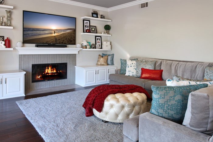 Living room with fireplace, sofa, and TV