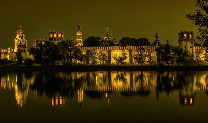 Novodevichy Monastery at night reflected in the river, Moscow, Russia