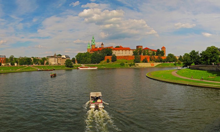 Motorboat on the Vistula River with Wawel Castle, Krakow