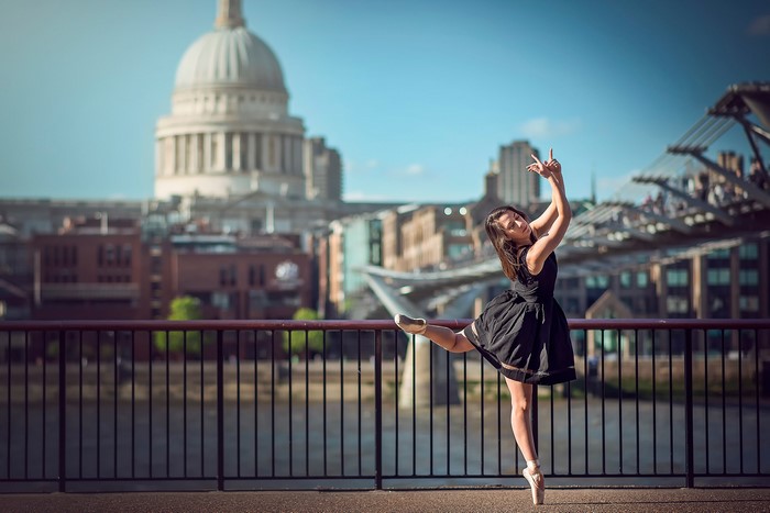 Ballerina dancing in front of London skyline