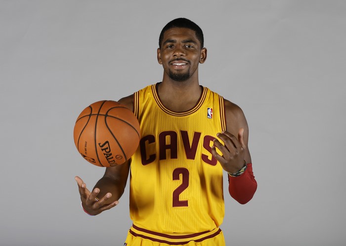 Kyrie Irving of the Cleveland Cavaliers with a basketball