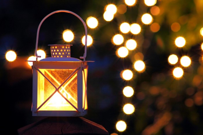 Lantern with bokeh lights at night