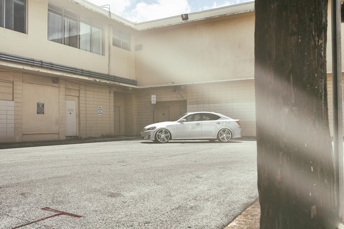 White Lexus IS250 with Vossen CV5 wheels on asphalt