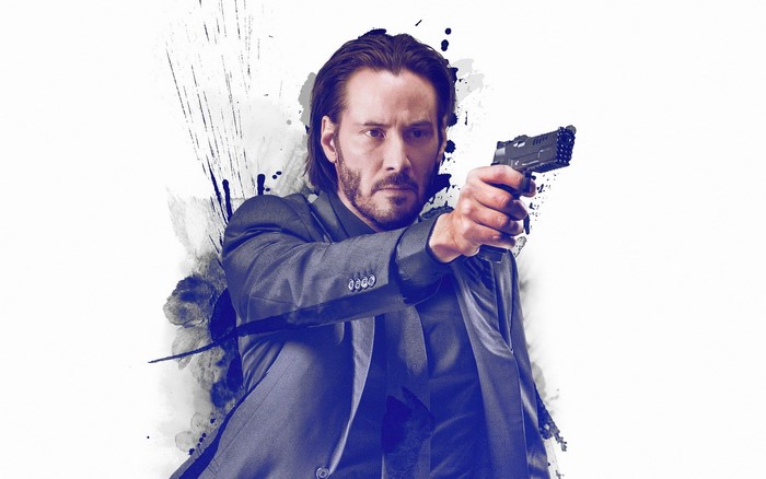 Keanu Reeves as John Wick holding a pistol