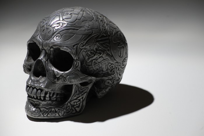 Close-up of a decorative skull with Celtic knotwork