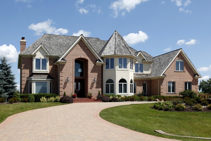 Luxury brick mansion with circular driveway