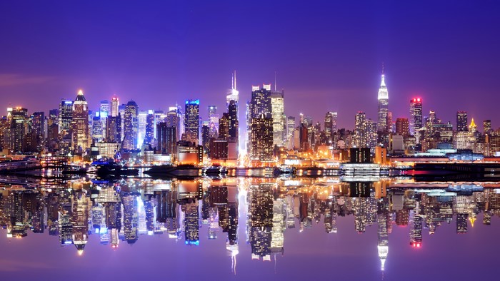 New York City Skyline at Night with River Reflection