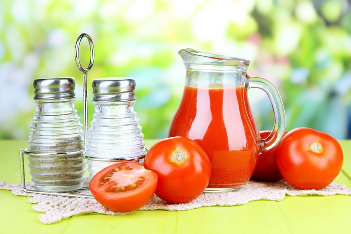 Tomatoes, Salt and Pepper Shakers, and Tomato Juice in a Pitcher