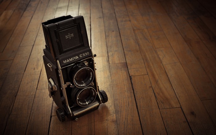 Mamiya C330 twin-lens reflex camera on wooden floor